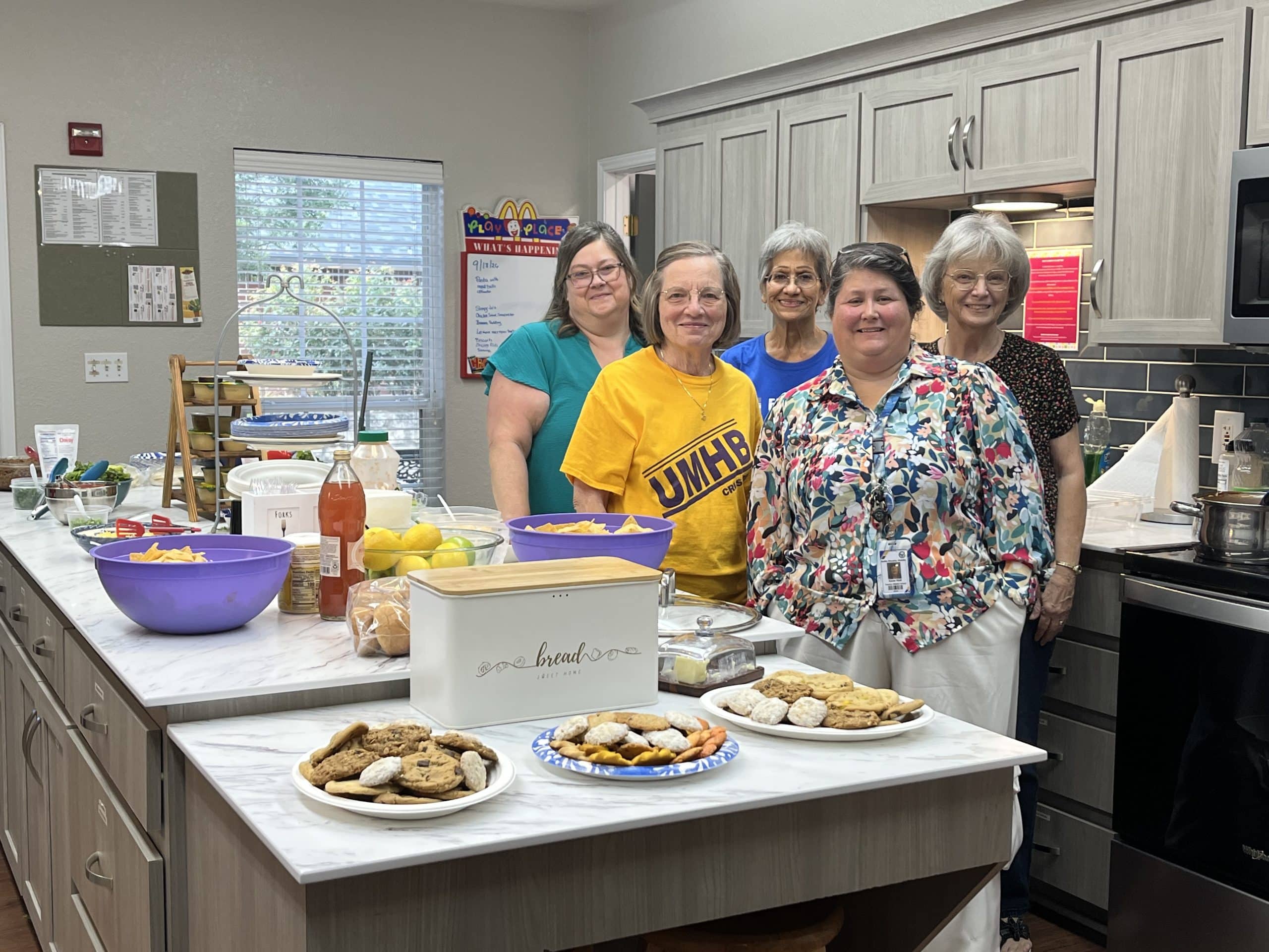 Volunteers from Friendship Baptist Church gathered in the Ronald McDonald House kitchen