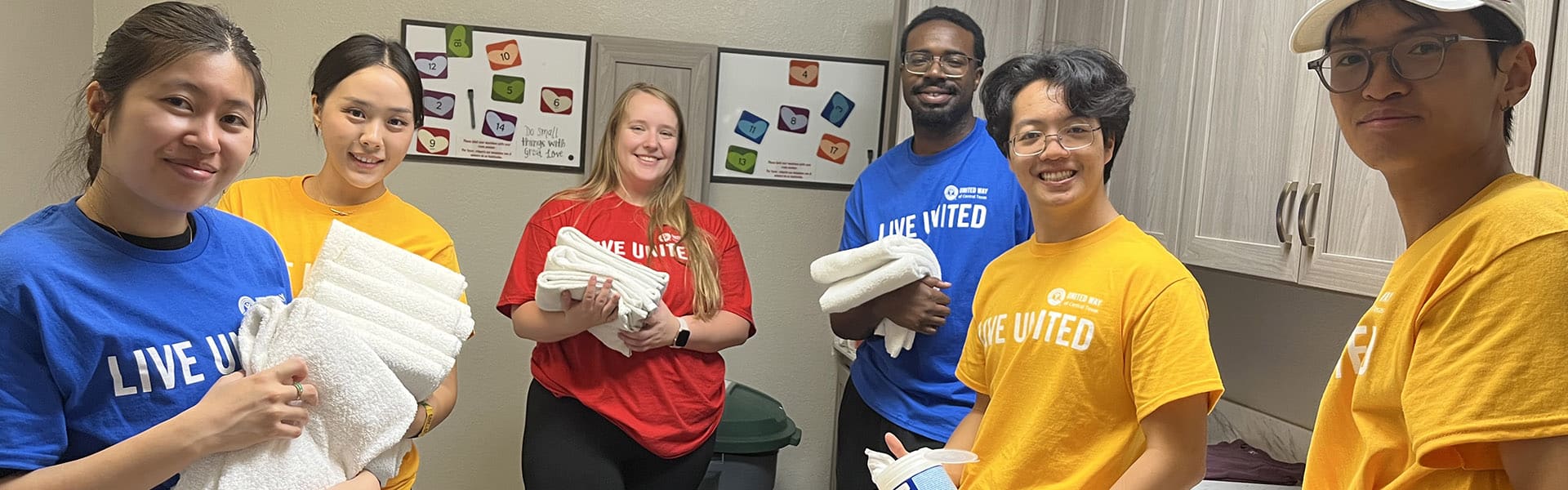 Group of volunteers with cleaning supplies at the Ronald McDonald House of Temple TX