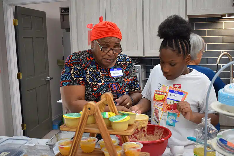 Two women volunteering in the kitchen of the Ronald McDonald House of Temple