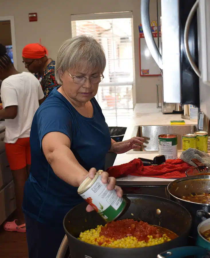 Lady volunteer cooking at the Ronald McDonald House of Temple