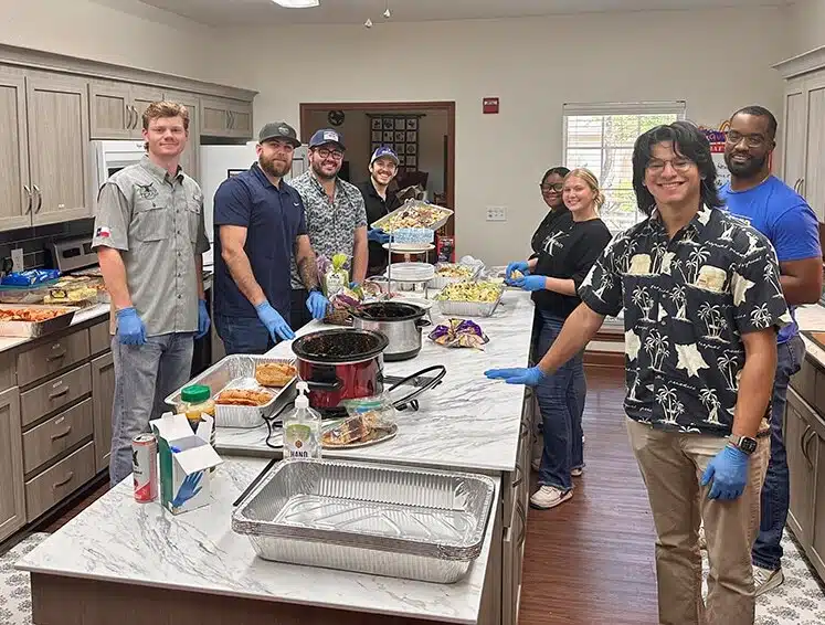 A Guest Chef program volunteer preparing a meal at the Ronald McDonald House of Temple