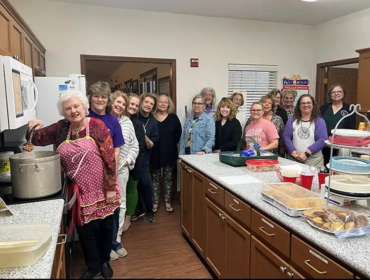 A Guest Chef program volunteer preparing a meal at the Ronald McDonald House of Temple